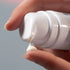 Dermalogica dynamic skin recovery 100ml (jumbo size) product being dispensed onto fingertip